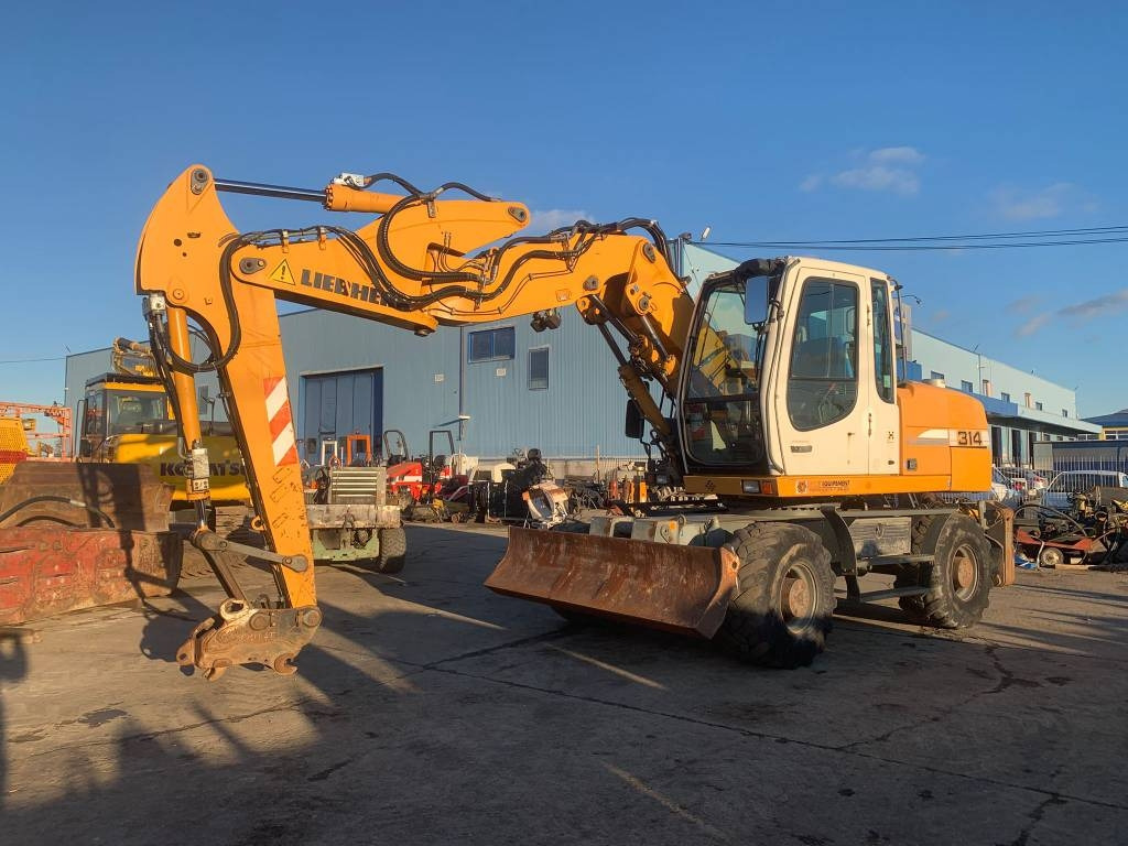 Liebherr A 314 Litronic - Escavadeira de rodas: foto 1 Liebherr A 314 Litronic - Escavadeira de rodas: foto 1