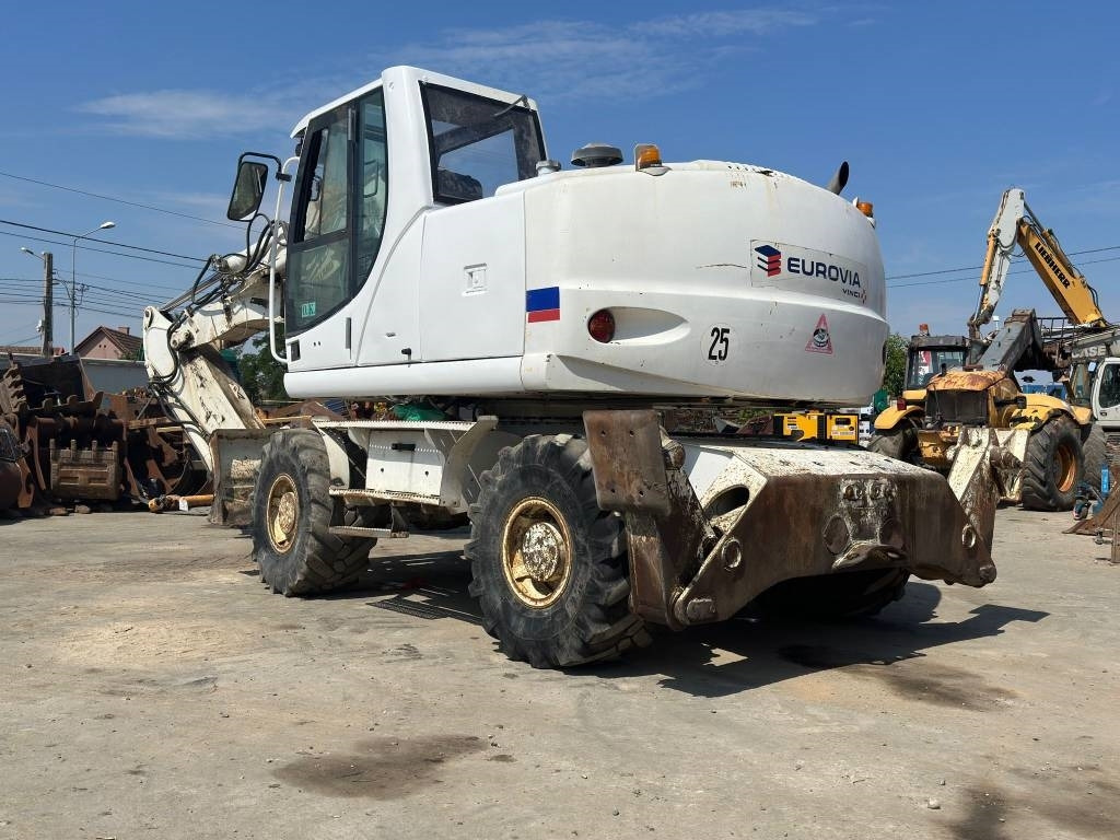 New Holland MH Plus - Escavadeira de rodas: foto 5 New Holland MH Plus - Escavadeira de rodas: foto 5