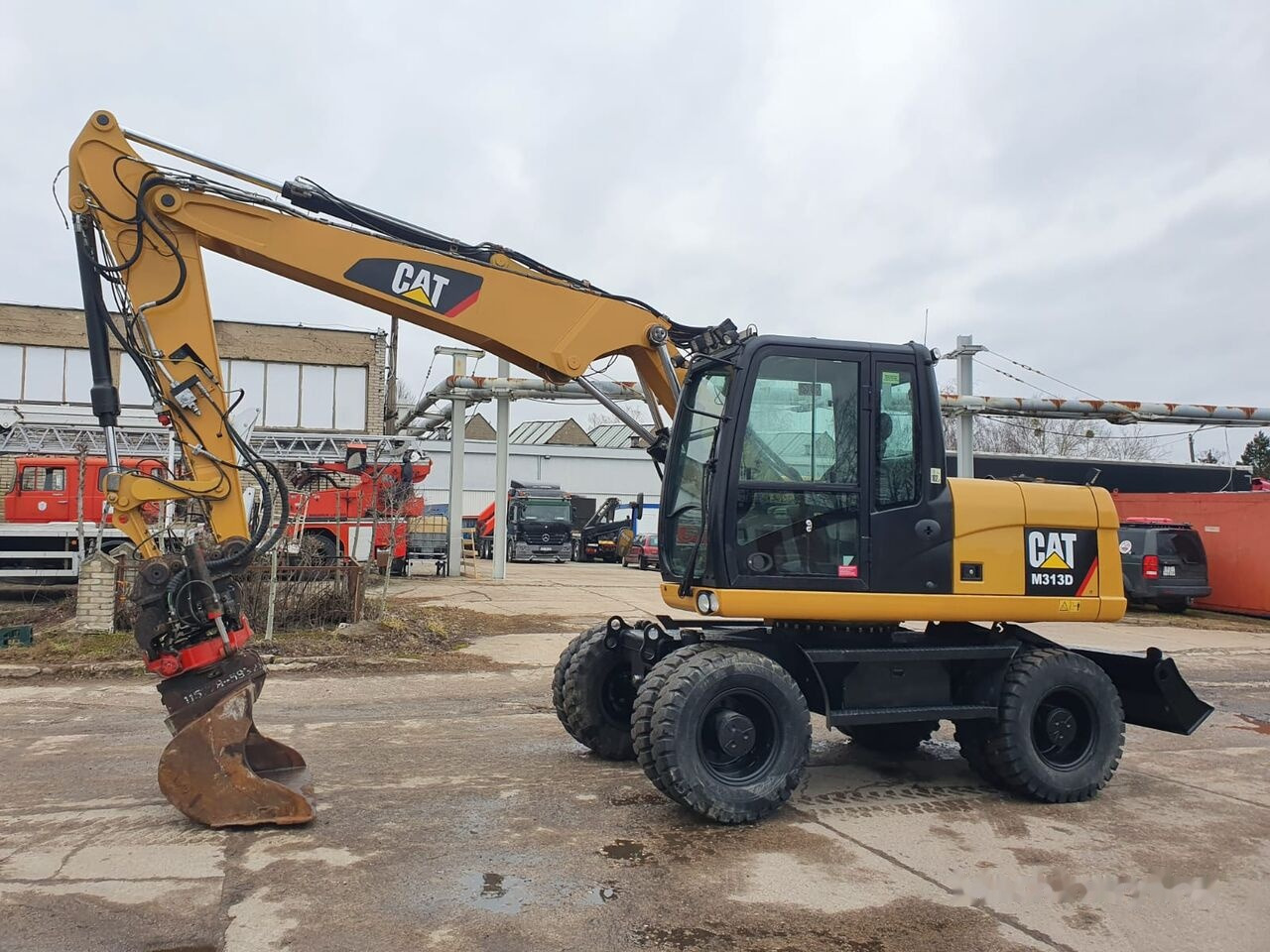 Caterpillar M 313 D Tiltrotator - Escavadeira de rodas: foto 2 Caterpillar M 313 D Tiltrotator - Escavadeira de rodas: foto 2