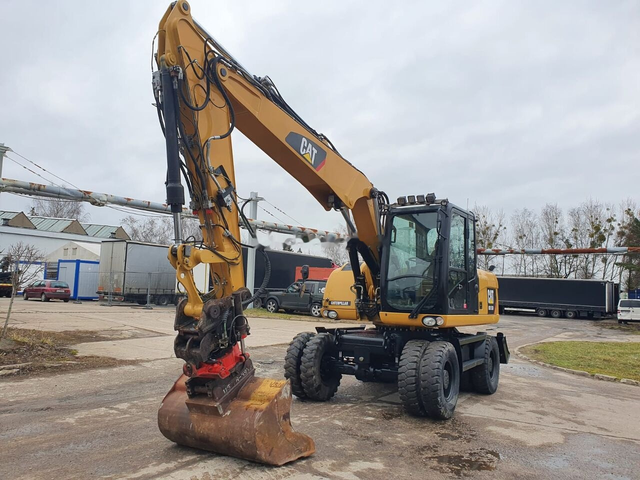 Caterpillar M 313 D Tiltrotator - Escavadeira de rodas: foto 4 Caterpillar M 313 D Tiltrotator - Escavadeira de rodas: foto 4