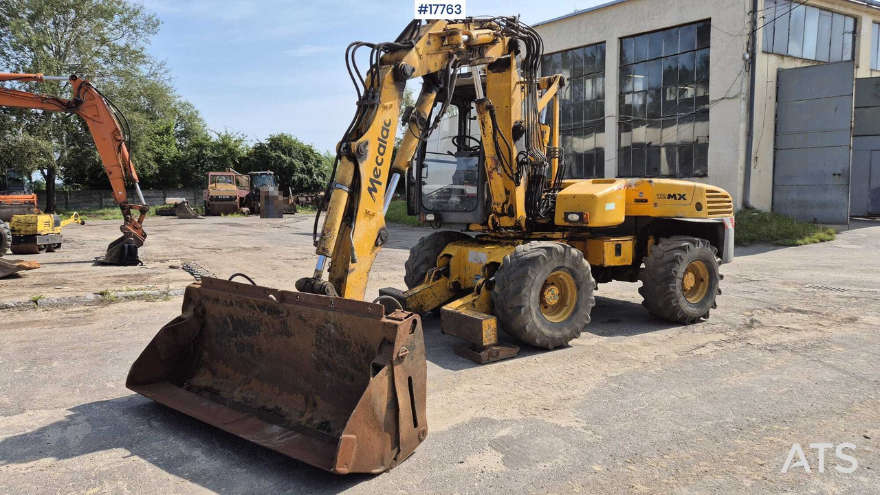 MECALAC 12MX wheeled excavator (1996) - Escavadeira de rodas: foto 1 MECALAC 12MX wheeled excavator (1996) - Escavadeira de rodas: foto 1