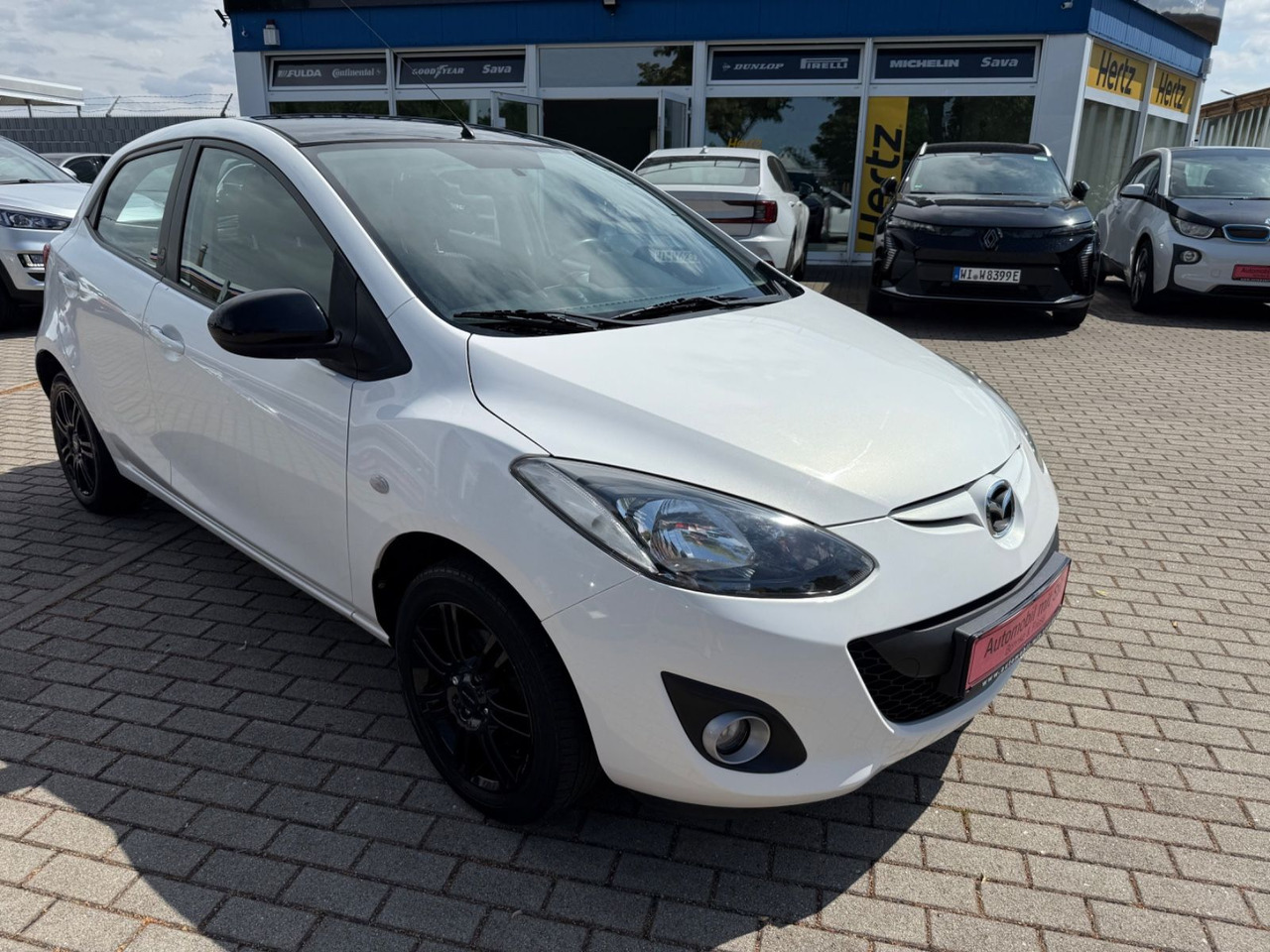 Mazda 2 Lim. 1.3 Origami 5 TÜER KLIMA SHZ TÜV NEU - Automóvel: foto 2 Mazda 2 Lim. 1.3 Origami 5 TÜER KLIMA SHZ TÜV NEU - Automóvel: foto 2