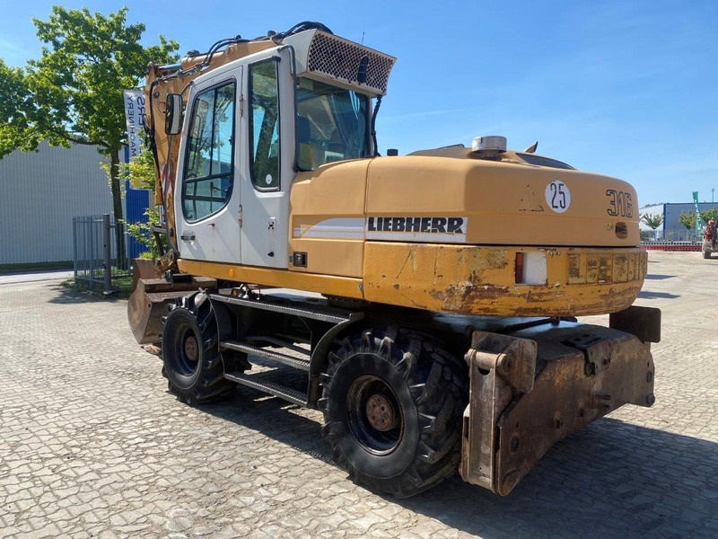 Liebherr A316 Litronic A 316 litronic - Escavadeira de rodas: foto 1 Liebherr A316 Litronic A 316 litronic - Escavadeira de rodas: foto 1