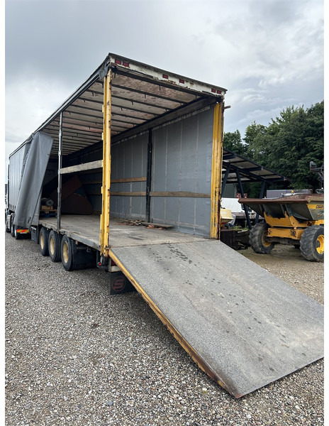 Schmitz Cargobull Machine transport trailer with bag ramp - Semi-reboque baixa: foto 1 Schmitz Cargobull Machine transport trailer with bag ramp - Semi-reboque baixa: foto 1