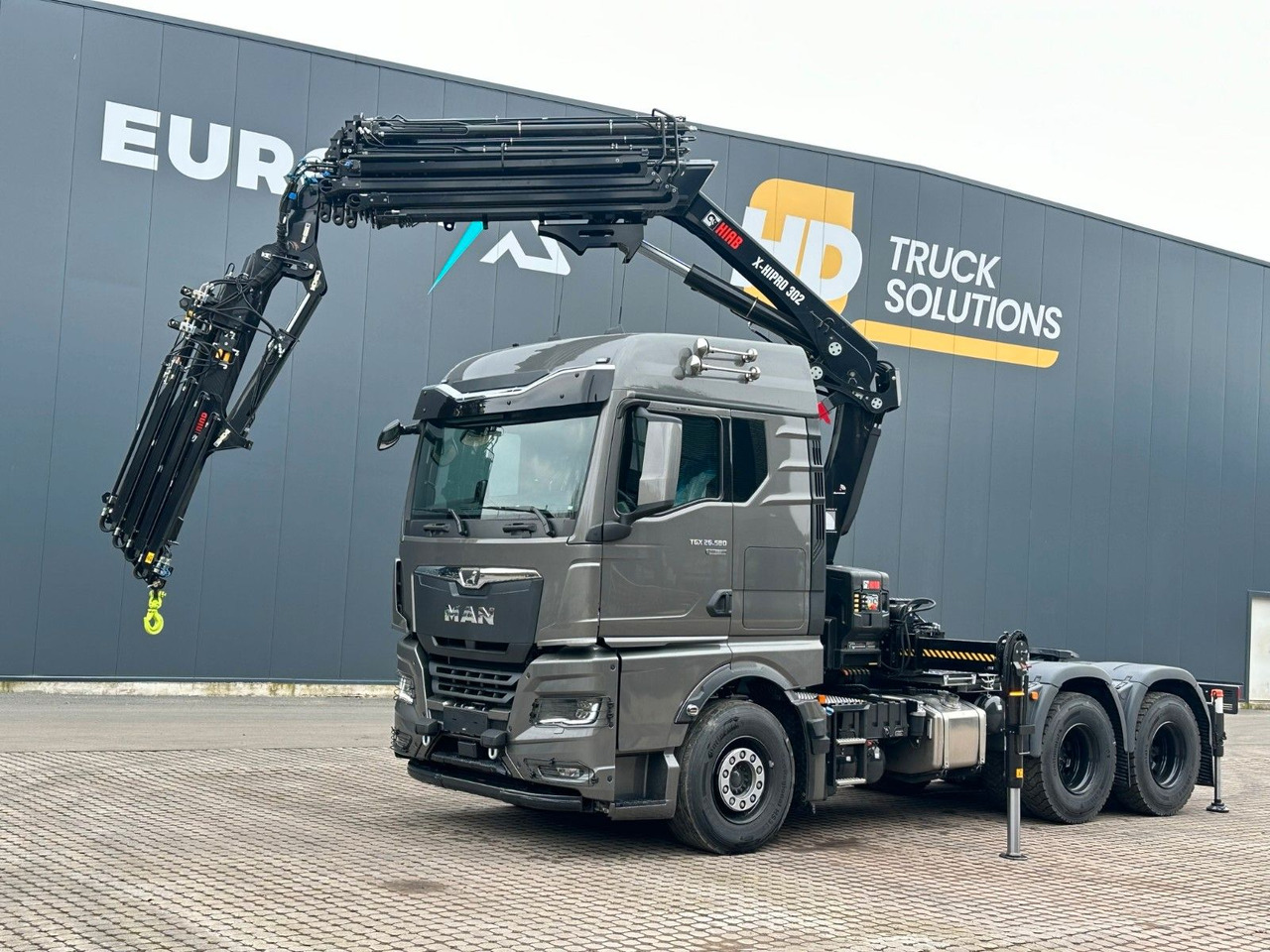 MAN TGX 26.580 6x4 Kran Hiab 302-6 + Jib-4 - Camião grua: foto 1 MAN TGX 26.580 6x4 Kran Hiab 302-6 + Jib-4 - Camião grua: foto 1