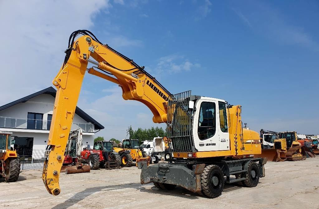 Liebherr A 316 Litronic - Manipulador de material: foto 1 Liebherr A 316 Litronic - Manipulador de material: foto 1