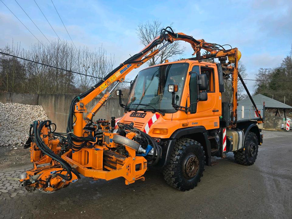 Unimog U400 2013 405/10 405/12 NKS-Z-UGN-43K Bluetec 5 Mercedes-Benz UGE UGN Mulag MKM700 Mähausleger Böschungsmäher Böschungsmulcher Küpper-Weisser IMS Salzstreuer - Veículo municipal/ Especial: foto 1 Unimog U400 2013 405/10 405/12 NKS-Z-UGN-43K Bluetec 5 Mercedes-Benz UGE UGN Mulag MKM700 Mähausleger Böschungsmäher Böschungsmulcher Küpper-Weisser IMS Salzstreuer - Veículo municipal/ Especial: foto 1