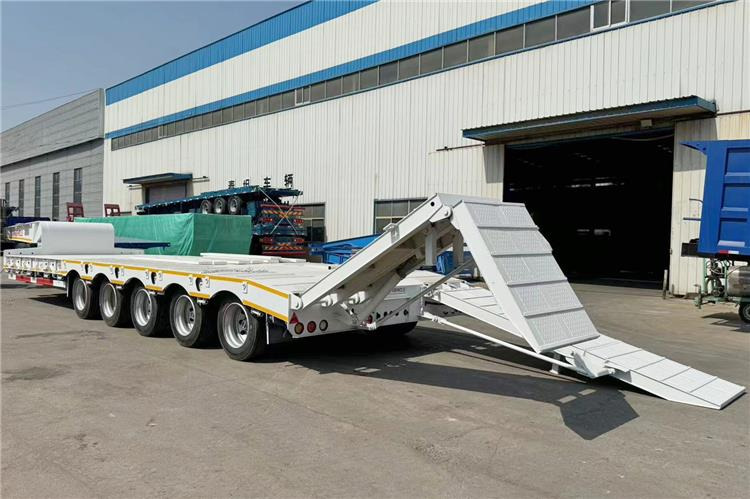 TITAN 5 Axle 100 Ton Low Bed Trailer for Sale In Tanzania - Semi-reboque baixa: foto 1 TITAN 5 Axle 100 Ton Low Bed Trailer for Sale In Tanzania - Semi-reboque baixa: foto 1