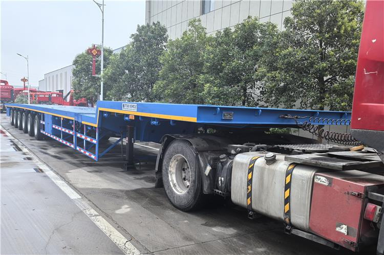 TITAN 6 Axle 54m Telescopic Flatbed Trailer for Sale In Angola - Semi-reboque plataforma/ Caixa aberta: foto 3 TITAN 6 Axle 54m Telescopic Flatbed Trailer for Sale In Angola - Semi-reboque plataforma/ Caixa aberta: foto 3