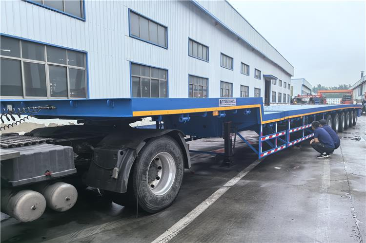 TITAN 6 Axle 54m Telescopic Flatbed Trailer for Sale In Angola - Semi-reboque plataforma/ Caixa aberta: foto 1 TITAN 6 Axle 54m Telescopic Flatbed Trailer for Sale In Angola - Semi-reboque plataforma/ Caixa aberta: foto 1