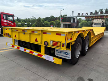 TITAN Rgn Lowboy Trailer for Sale in Zambia - Semi-reboque baixa: foto 1 TITAN Rgn Lowboy Trailer for Sale in Zambia - Semi-reboque baixa: foto 1