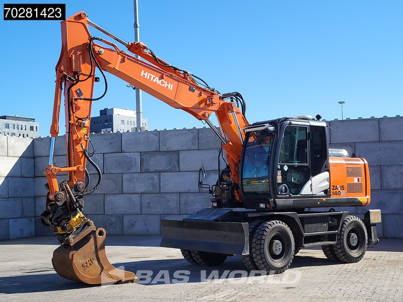 Hitachi ZX140W -5 OUTRIGGERS + BLADE - Escavadeira de rodas: foto 2 Hitachi ZX140W -5 OUTRIGGERS + BLADE - Escavadeira de rodas: foto 2
