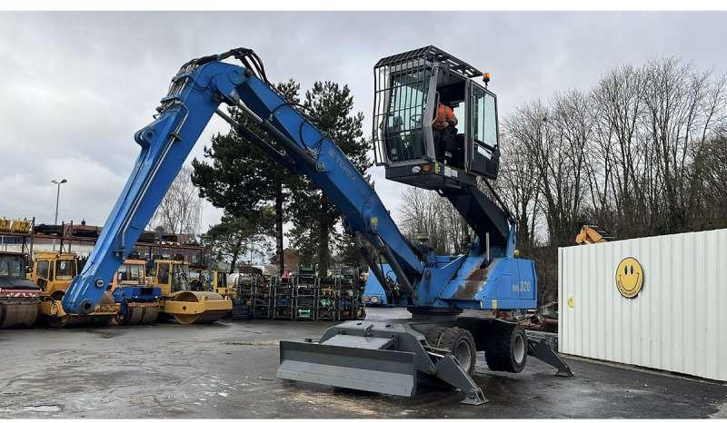 Fuchs MHL320 - Manipulador de material: foto 1 Fuchs MHL320 - Manipulador de material: foto 1