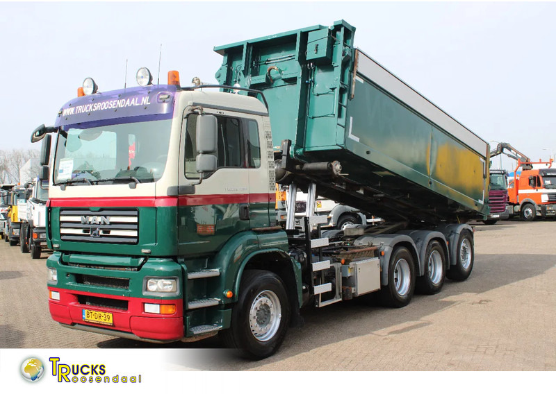 MAN TGA 35.400 8X4 + MANUAL! + NCH kipper/ bitum sprayer - Camião com sistema de cabo: foto 1 MAN TGA 35.400 8X4 + MANUAL! + NCH kipper/ bitum sprayer - Camião com sistema de cabo: foto 1