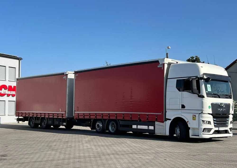 MAN TGX 26.470 z przyczepą Redos - Camião de lona: foto 2 MAN TGX 26.470 z przyczepą Redos - Camião de lona: foto 2