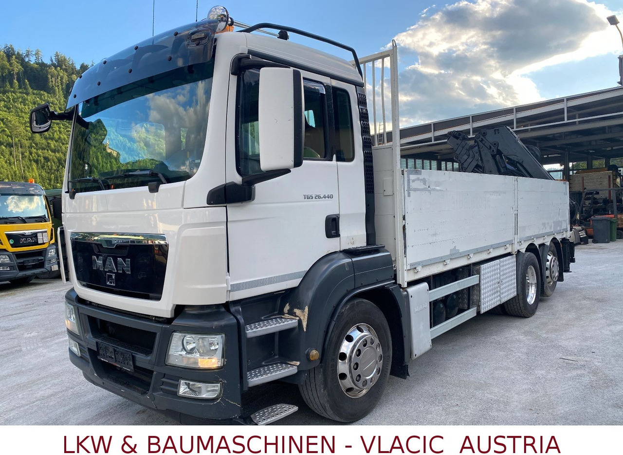 MAN 26.440 mit Kran HIAB 166 5XHydraulikauschub - Camião de caixa aberta/ Plataforma, Camião grua: foto 1 MAN 26.440 mit Kran HIAB 166 5XHydraulikauschub - Camião de caixa aberta/ Plataforma, Camião grua: foto 1