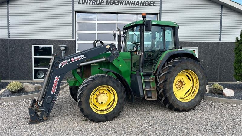 John Deere 6910 Auto Quad II-TLS Med frontlæsser - Trator: foto 1 John Deere 6910 Auto Quad II-TLS Med frontlæsser - Trator: foto 1