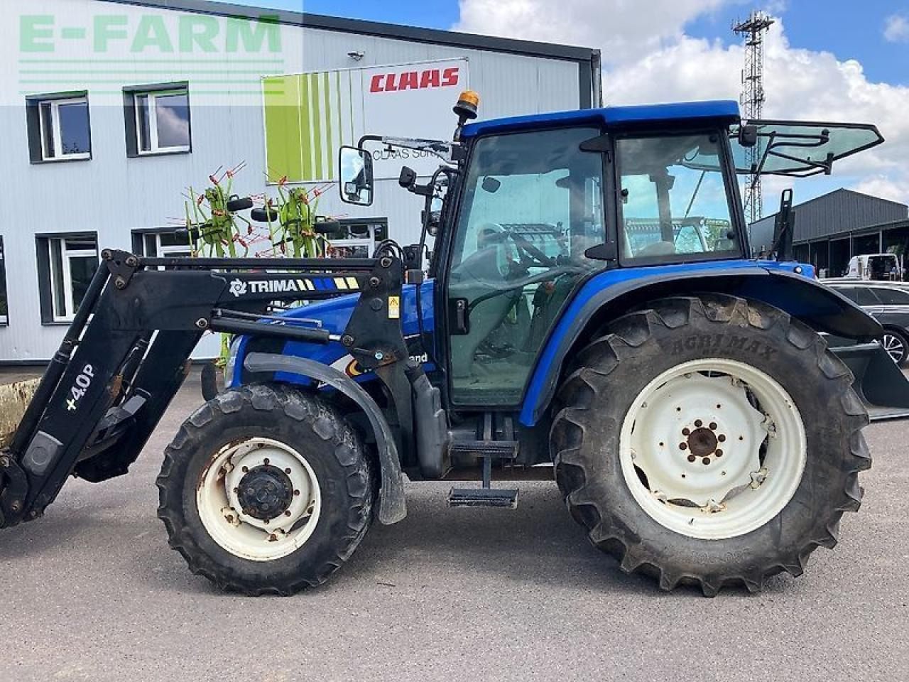 New Holland tl 100 a A - Trator: foto 1 New Holland tl 100 a A - Trator: foto 1