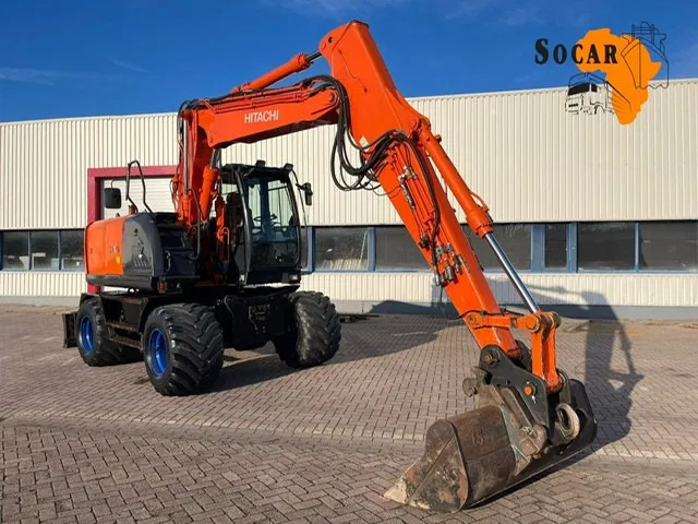 Hitachi ZX 140W-3 - Escavadeira de rodas: foto 1 Hitachi ZX 140W-3 - Escavadeira de rodas: foto 1