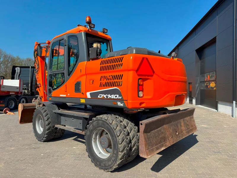 Doosan DX140-3 6000 uur ! NL Machine - Escavadeira de rodas: foto 2 Doosan DX140-3 6000 uur ! NL Machine - Escavadeira de rodas: foto 2