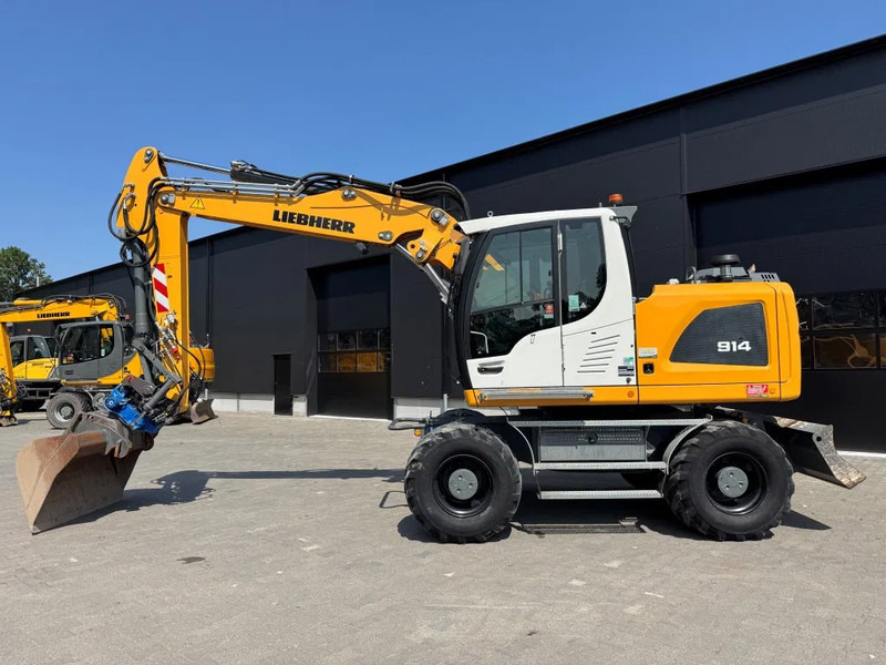 Liebherr A914 2019 7300 uur !! NL MACHINE !! - Escavadeira de rodas: foto 1 Liebherr A914 2019 7300 uur !! NL MACHINE !! - Escavadeira de rodas: foto 1