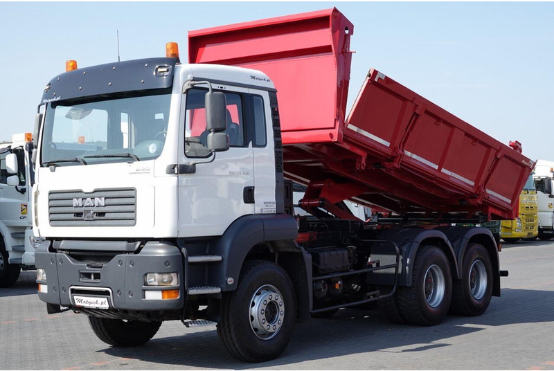MAN TGA 33.390 / 6X4 / WYWROTKA 2 STRONNA / HYDROBURTA / MANUAL / SP - Camião basculante: foto 1 MAN TGA 33.390 / 6X4 / WYWROTKA 2 STRONNA / HYDROBURTA / MANUAL / SP - Camião basculante: foto 1