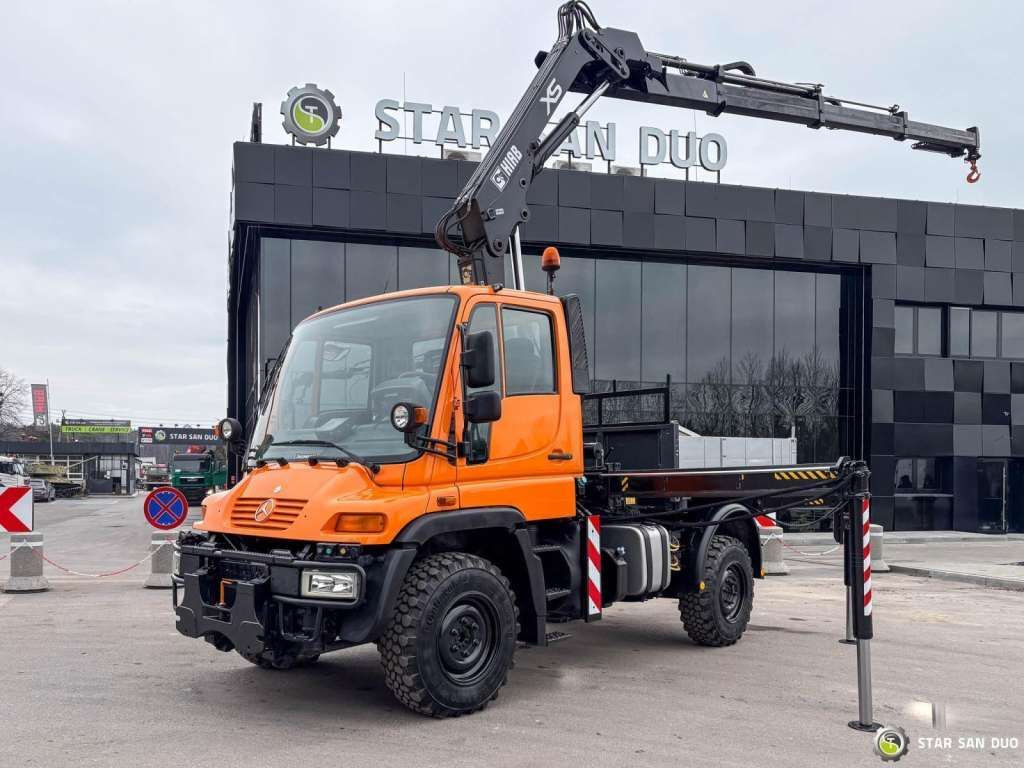 Unimog Mercedes-Benz UNIMOG U300 4x4 HIAB 122 D-3 CRANE Unimog Mercedes-Benz UNIMOG U300 4x4 HIAB 122 D-3 CRANE - Camião grua, Camião de caixa aberta/ Plataforma: foto 1 Unimog Mercedes-Benz UNIMOG U300 4x4 HIAB 122 D-3 CRANE Unimog Mercedes-Benz UNIMOG U300 4x4 HIAB 122 D-3 CRANE - Camião grua, Camião de caixa aberta/ Plataforma: foto 1