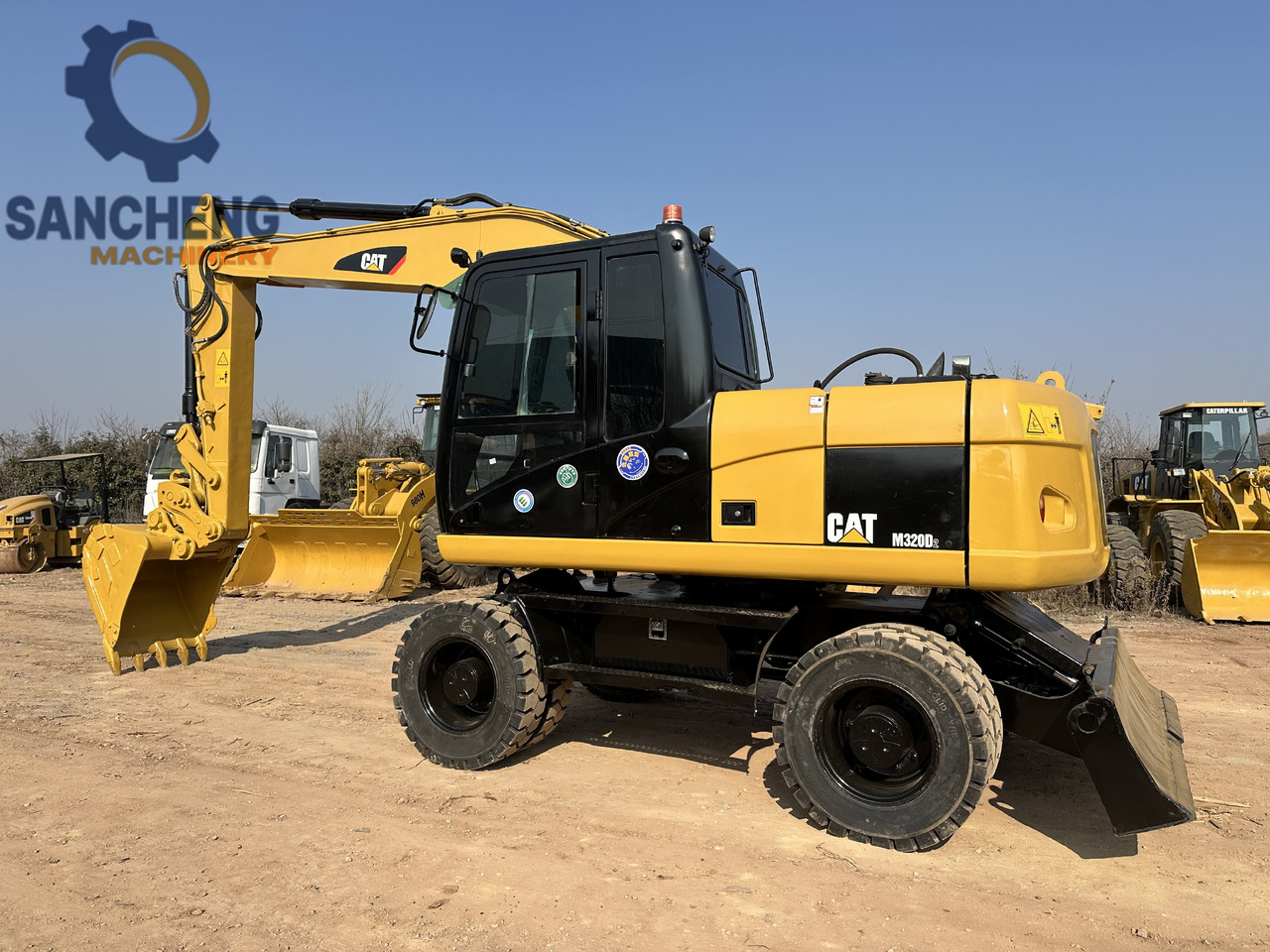 CATERPILLAR M320D2 - Escavadeira de rodas: foto 1 CATERPILLAR M320D2 - Escavadeira de rodas: foto 1