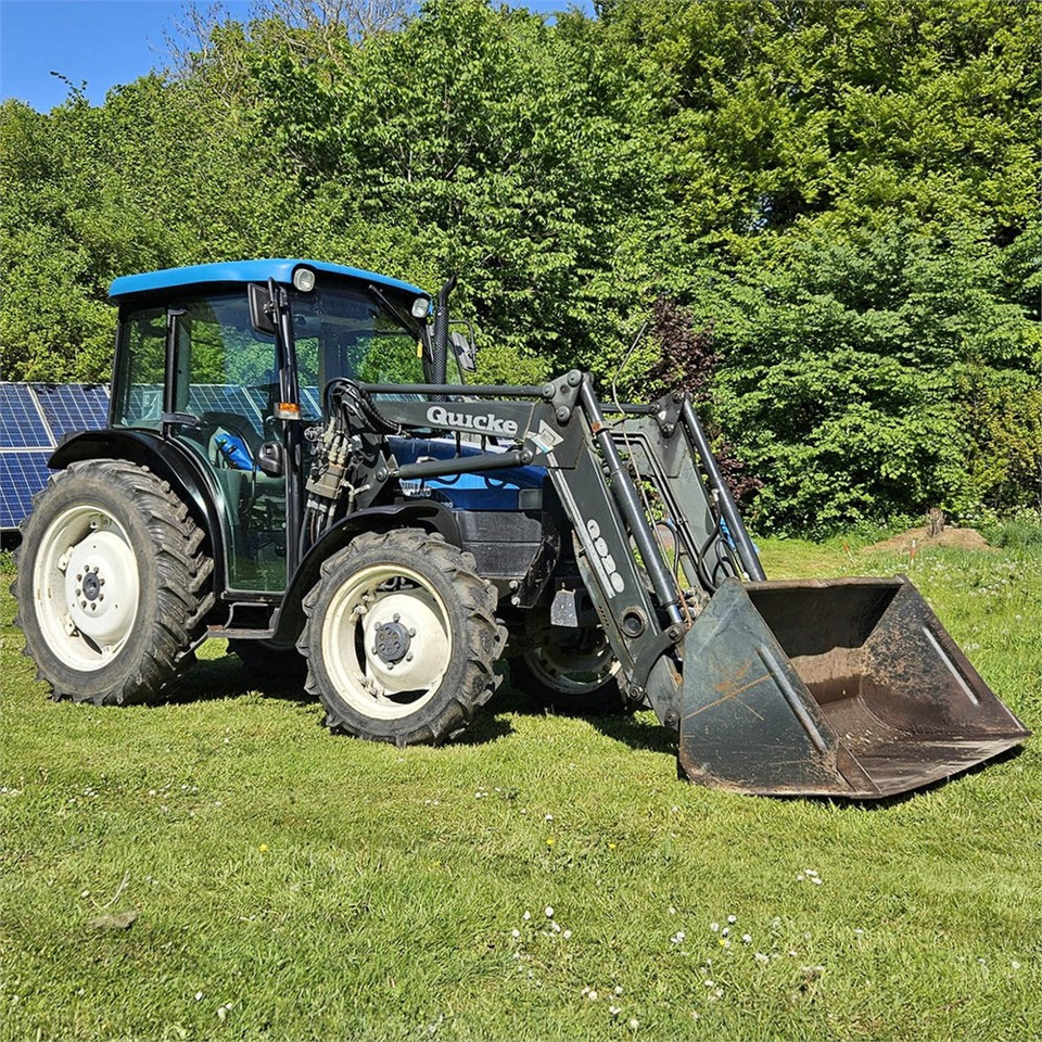 New Holland TN55D - Trator: foto 1 New Holland TN55D - Trator: foto 1