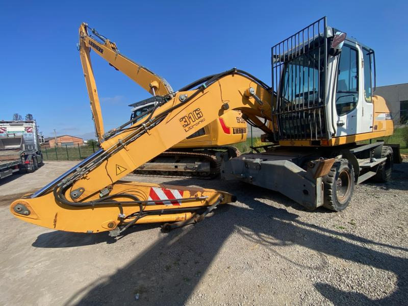 Liebherr A316Litronic - Escavadeira de rodas: foto 2 Liebherr A316Litronic - Escavadeira de rodas: foto 2